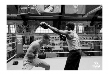 Boxer Passelle with coach Paul at Repton Boxing Club&nbsp;wearing Baracuta A/W 23. Styled by Mark Anthony Bradley. Produced by Cold Archive